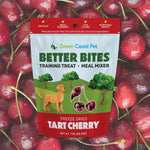 Green Coast Pet Better Bites training treat package with tart cherry flavor on a background of red cherries.