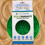Green Coast Pet Treat & Tranquility Calming Treat Mat packaging on a peanut butter background